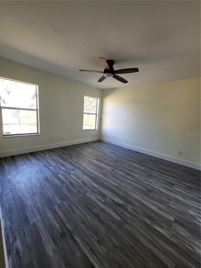1302 E Annie St, Tampa, FL 33612 - spare room with dark wood-style flooring and ceiling fan