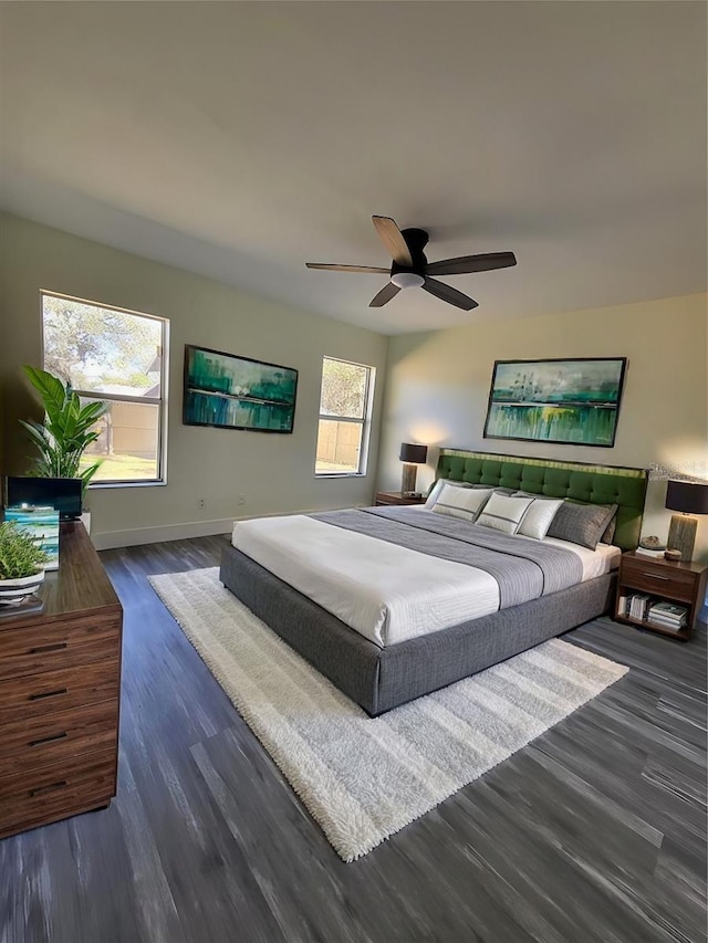 bedroom featuring ceiling fan and dark wood-type flooring