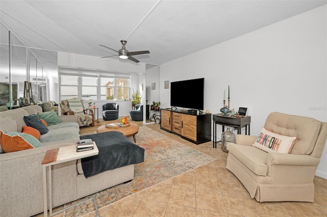 tiled living room featuring a textured ceiling and ceiling fan