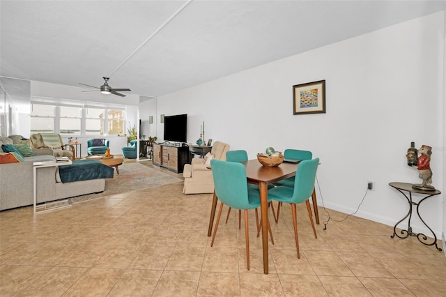 dining area featuring ceiling fan and light tile patterned floors