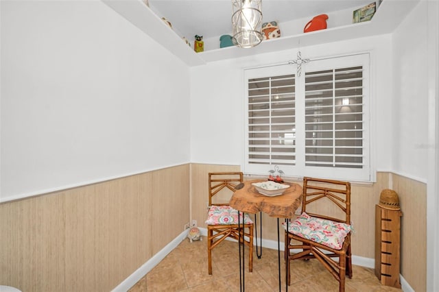 tiled dining area with wood walls