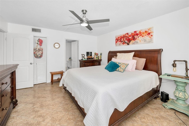 tiled bedroom with ceiling fan