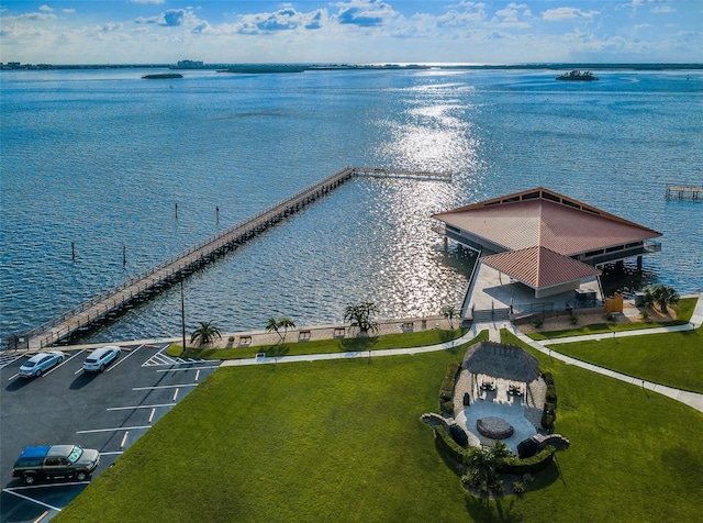 birds eye view of property with a water view