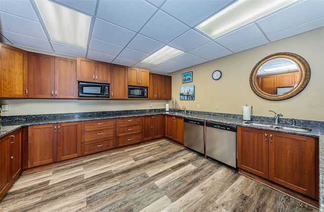 kitchen with dishwasher, black microwave, and sink