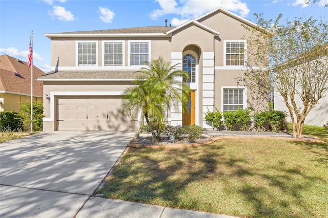 view of front of property with a garage and a front yard