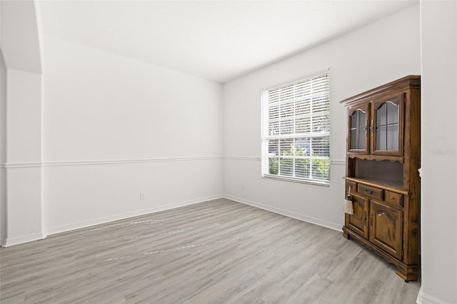 spare room featuring light wood-type flooring