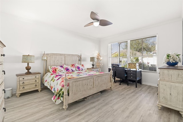 bedroom with ceiling fan, light hardwood / wood-style floors, and ornamental molding