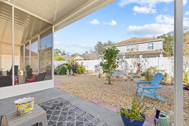 view of patio featuring a sunroom