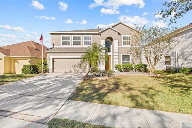 front facade with a front yard and a garage