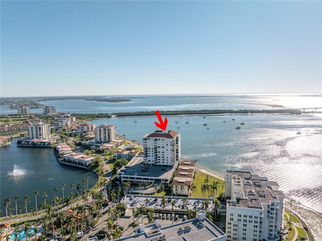 bird's eye view featuring a water view and a view of city