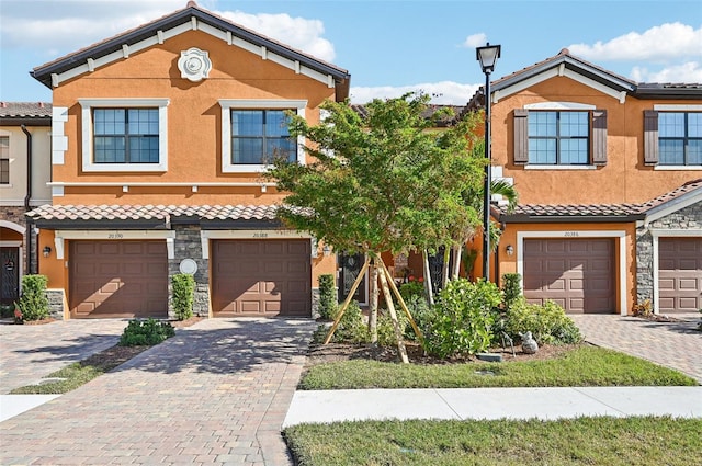 view of front of property with a garage