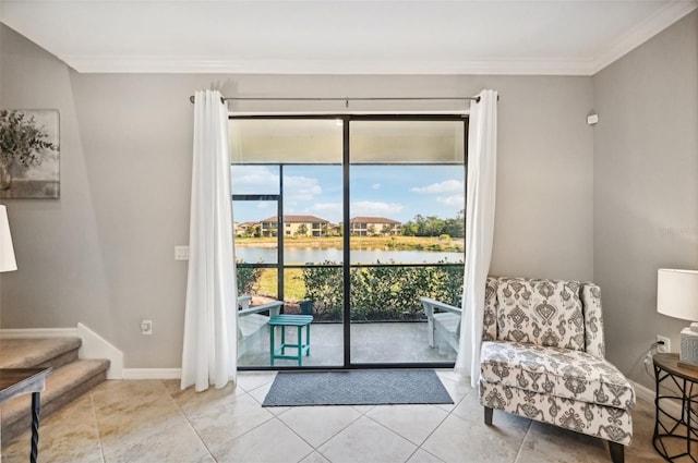 entryway with light tile patterned flooring, a water view, and crown molding