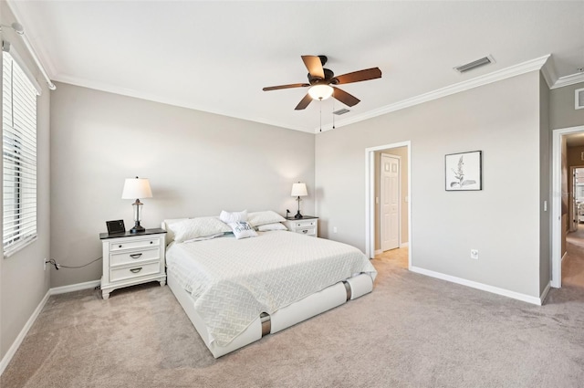 bedroom featuring ceiling fan, crown molding, and light carpet