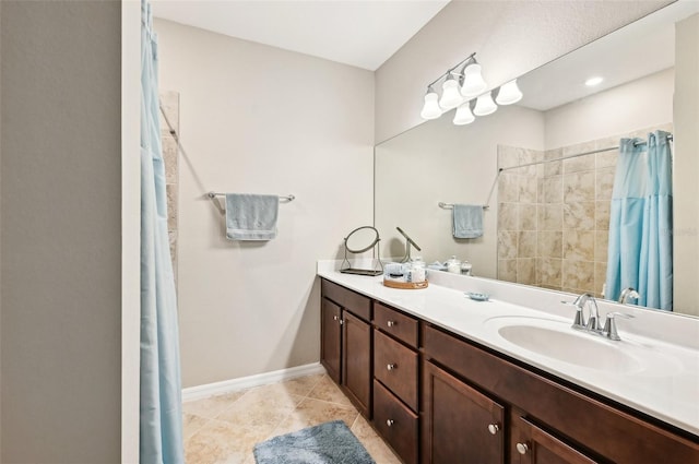 bathroom featuring vanity, tile patterned floors, and walk in shower