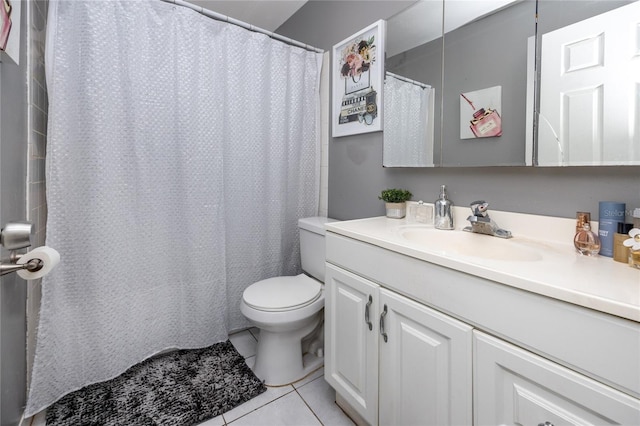 bathroom featuring tile patterned flooring, vanity, and toilet