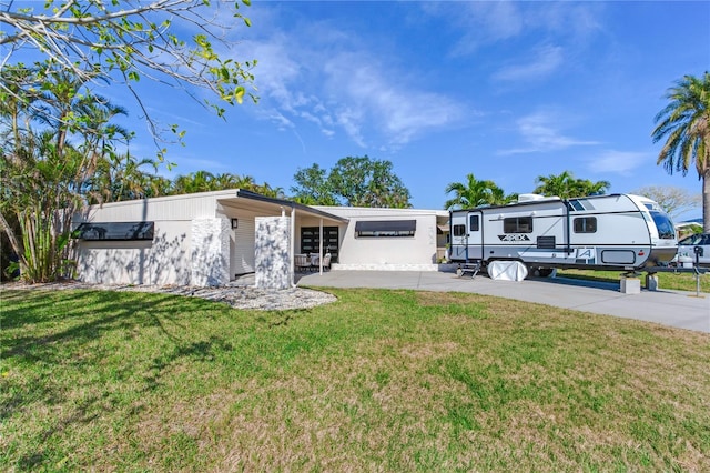 view of front of house with a front lawn