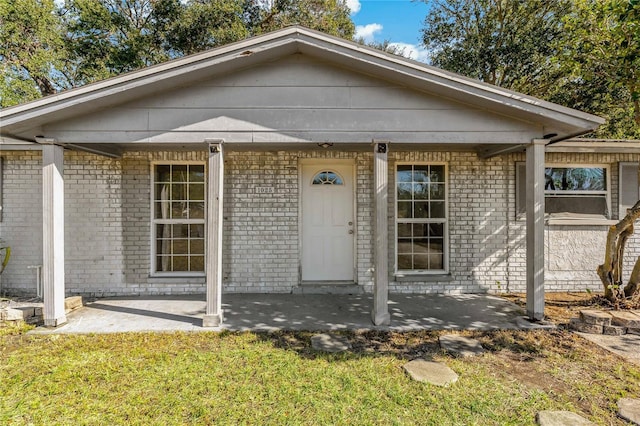 bungalow-style home featuring a patio area and a front yard