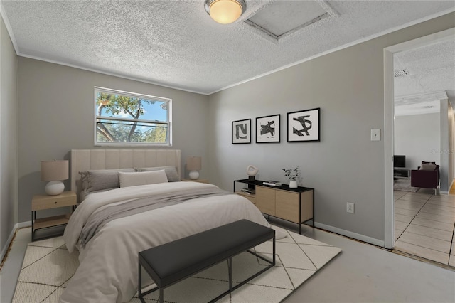 bedroom with ornamental molding and a textured ceiling