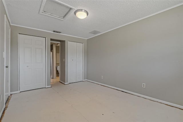 unfurnished bedroom with crown molding and a textured ceiling