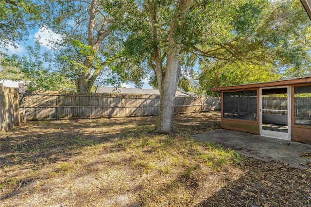 view of yard featuring a sunroom