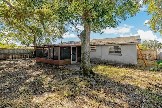 back of house with a sunroom