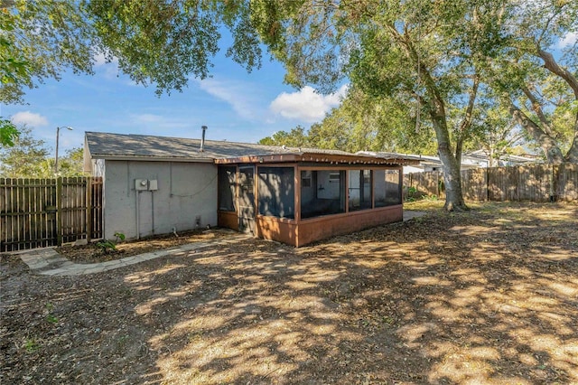 rear view of house with a sunroom