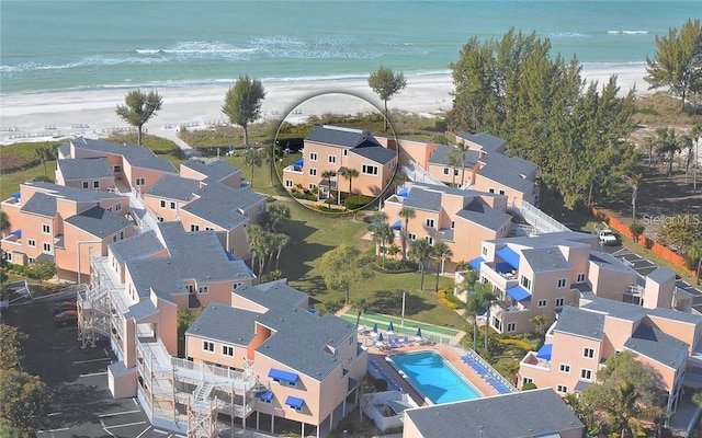 drone / aerial view featuring a view of the beach and a water view