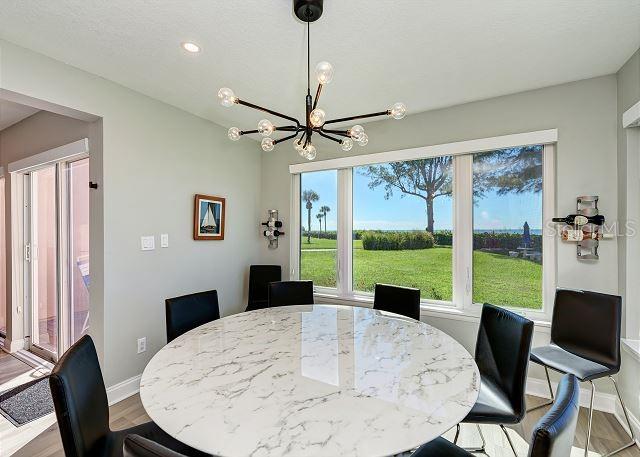 dining room featuring light hardwood / wood-style flooring and a notable chandelier