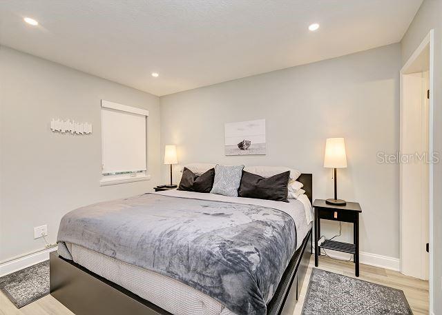 bedroom with light wood-type flooring