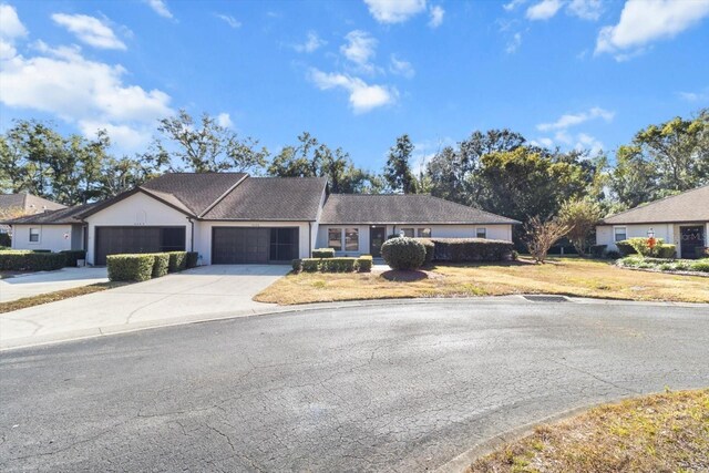 ranch-style house featuring a garage