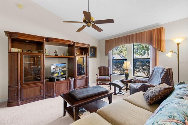 carpeted living room featuring ceiling fan and lofted ceiling