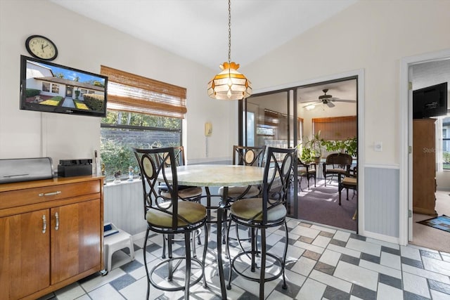 dining area with ceiling fan and lofted ceiling