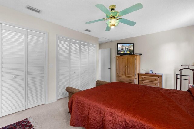 bedroom featuring light colored carpet and ceiling fan