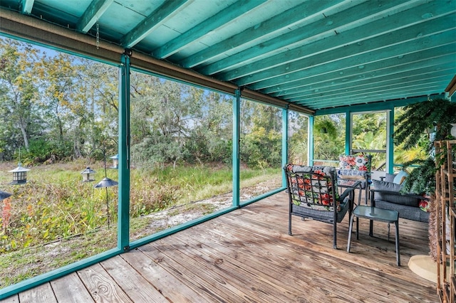 unfurnished sunroom featuring a wealth of natural light