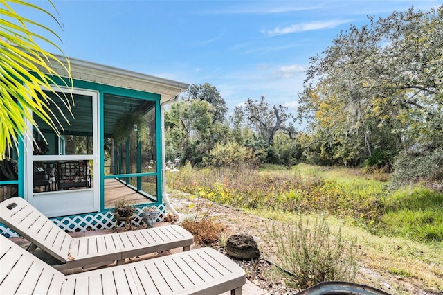 wooden terrace featuring a sunroom