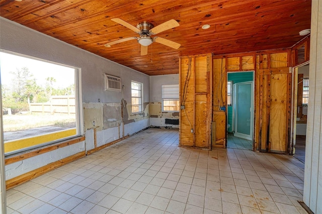 unfurnished room featuring wood ceiling, ceiling fan, a wall mounted AC, and light tile patterned floors