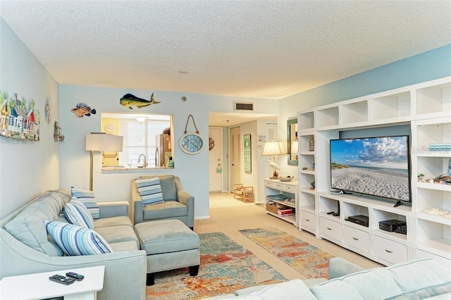 living room featuring a textured ceiling and light carpet