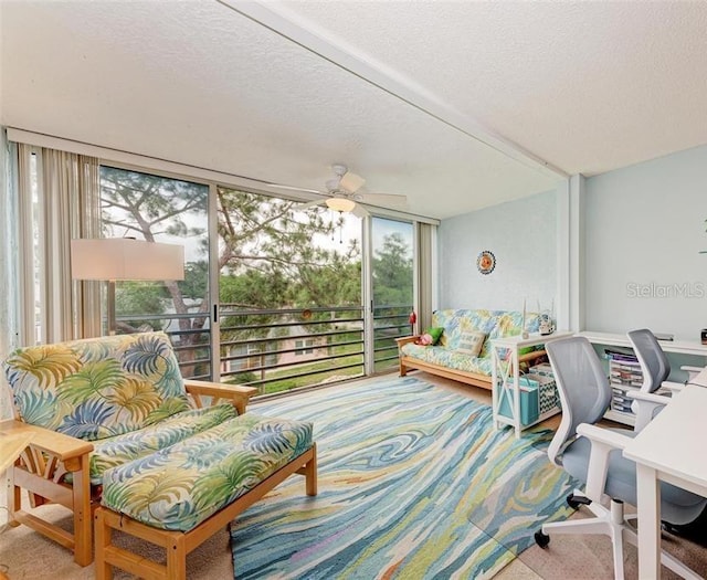 sunroom / solarium with ceiling fan and a healthy amount of sunlight