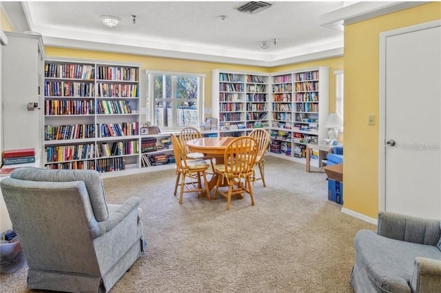 sitting room with carpet floors