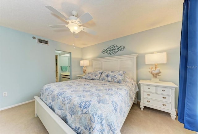 bedroom with ceiling fan and light carpet