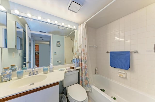 full bathroom featuring vanity, toilet, and shower / tub combo