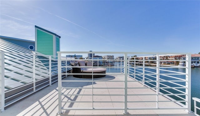 balcony featuring a water view