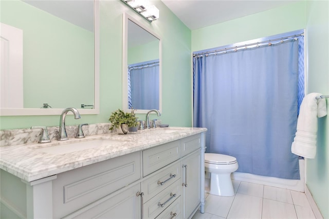 bathroom with toilet, vanity, tile patterned floors, and curtained shower