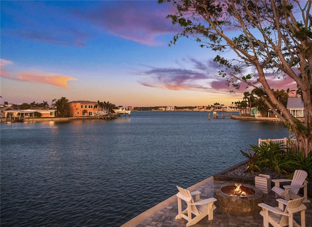 property view of water with an outdoor fire pit