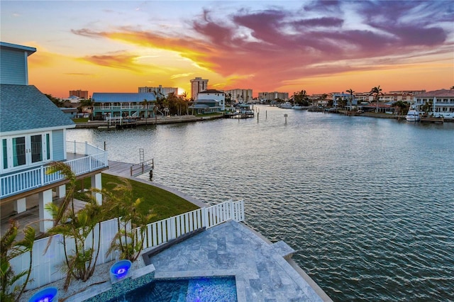 property view of water with a dock