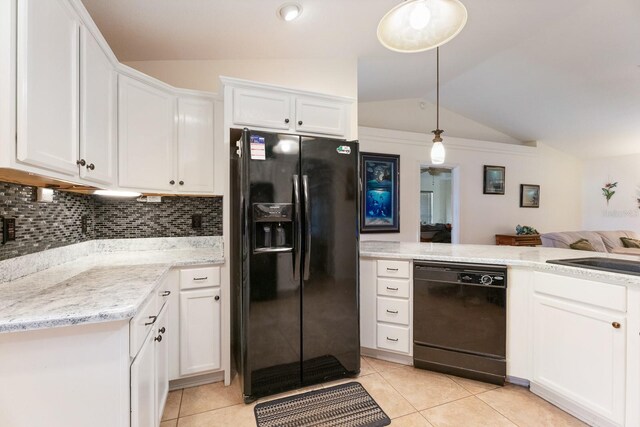 kitchen featuring lofted ceiling, black appliances, white cabinets, hanging light fixtures, and light tile patterned flooring