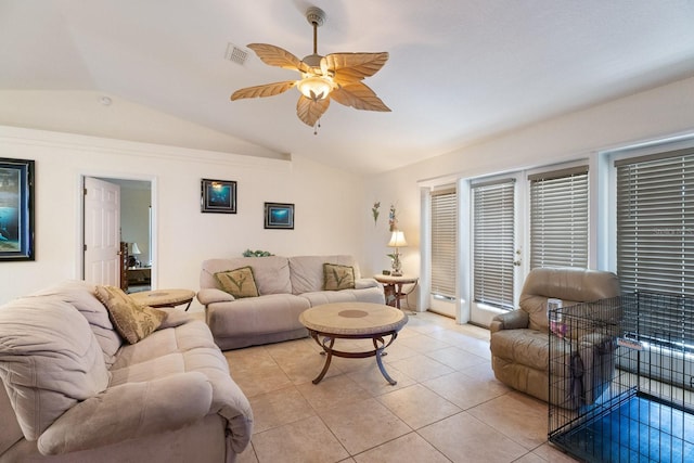 tiled living room with ceiling fan and vaulted ceiling