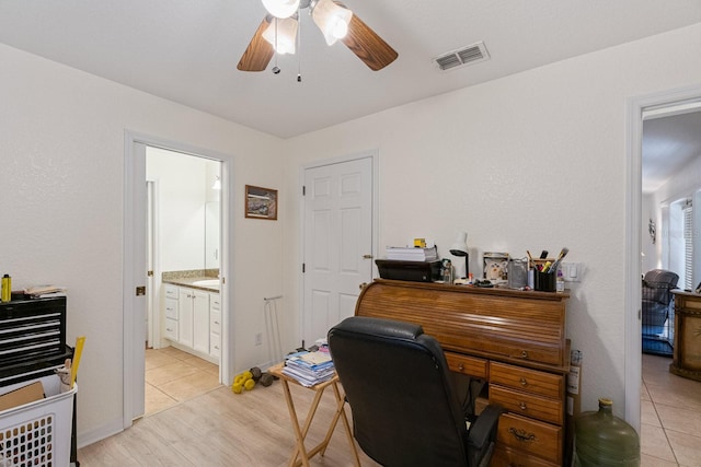 office space featuring ceiling fan and light hardwood / wood-style floors