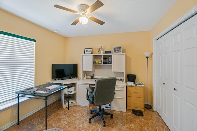 office space featuring ceiling fan