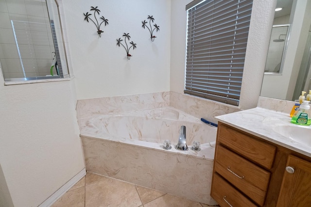 bathroom featuring tile patterned floors, vanity, and independent shower and bath